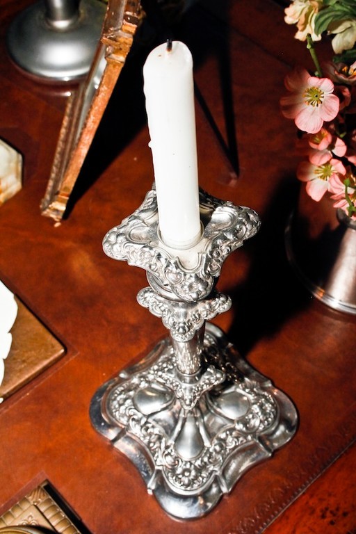 A candlestick, original to the house, sits on TR's desk in the Library.