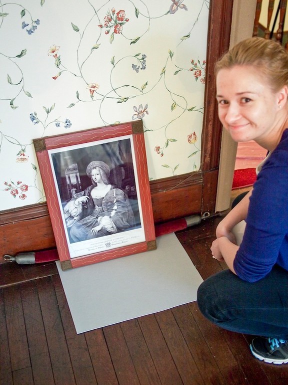 Laura Cinturati (Sag Hill museum technician) with an engraving "Portrait De Jeanne D'Arragon" still to be rehung in the "Big Guest Room" .