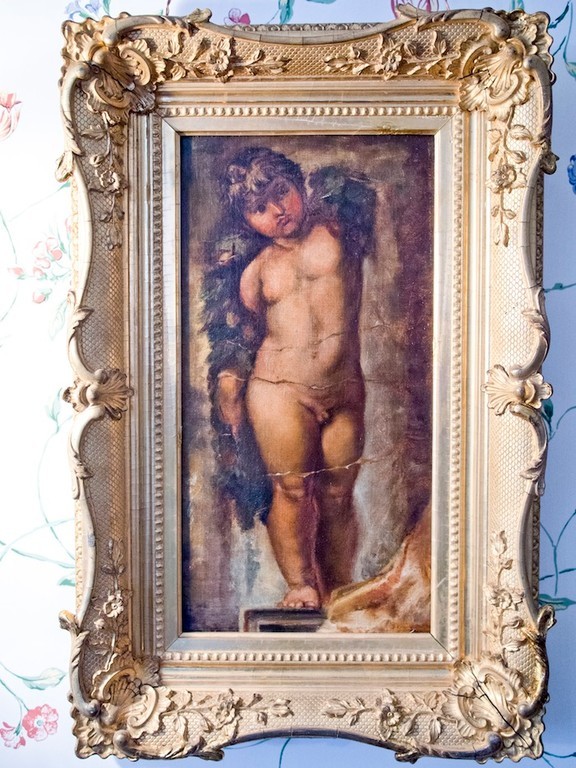 a painting in the "Big Guest Room" . painting title: "Good Luck To Your Fishing" artist: G.F. Watts.  depicts: cherub holding fishing line hovering over a green sea