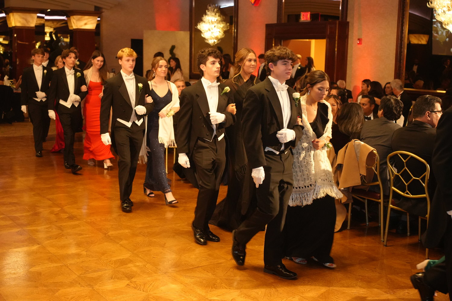 One of the many annual traditions at the Mercy Ball is the honor guard, comprised of high school students who escort the Grand March of dignitaries into the ballroom for the event.