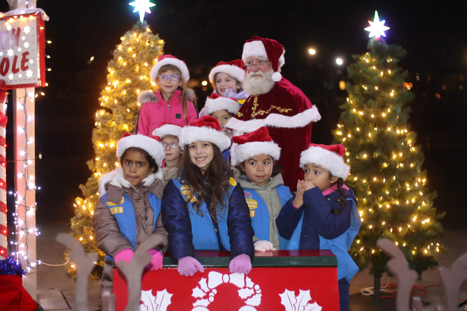 Daisy Troop 715 was able to snap a photo with Santa on his sled after greeting him with a Christmas song.