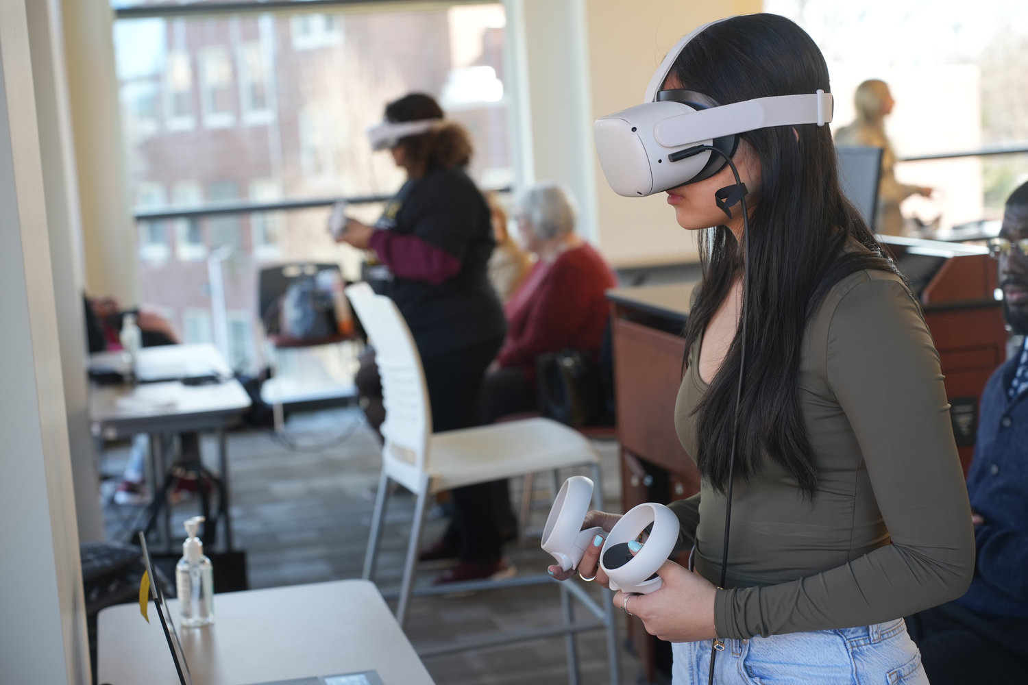 Kendra Teran, an 11th-grade student from Freeport High School tries out the virtual experience during the MLK Day of Service at Molloy University.